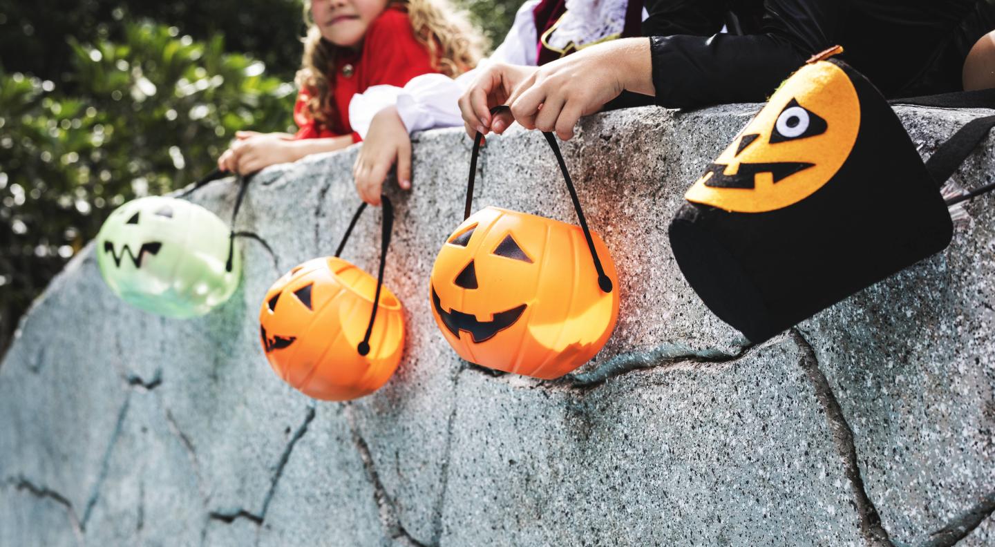 Little children trick or treating on Halloween