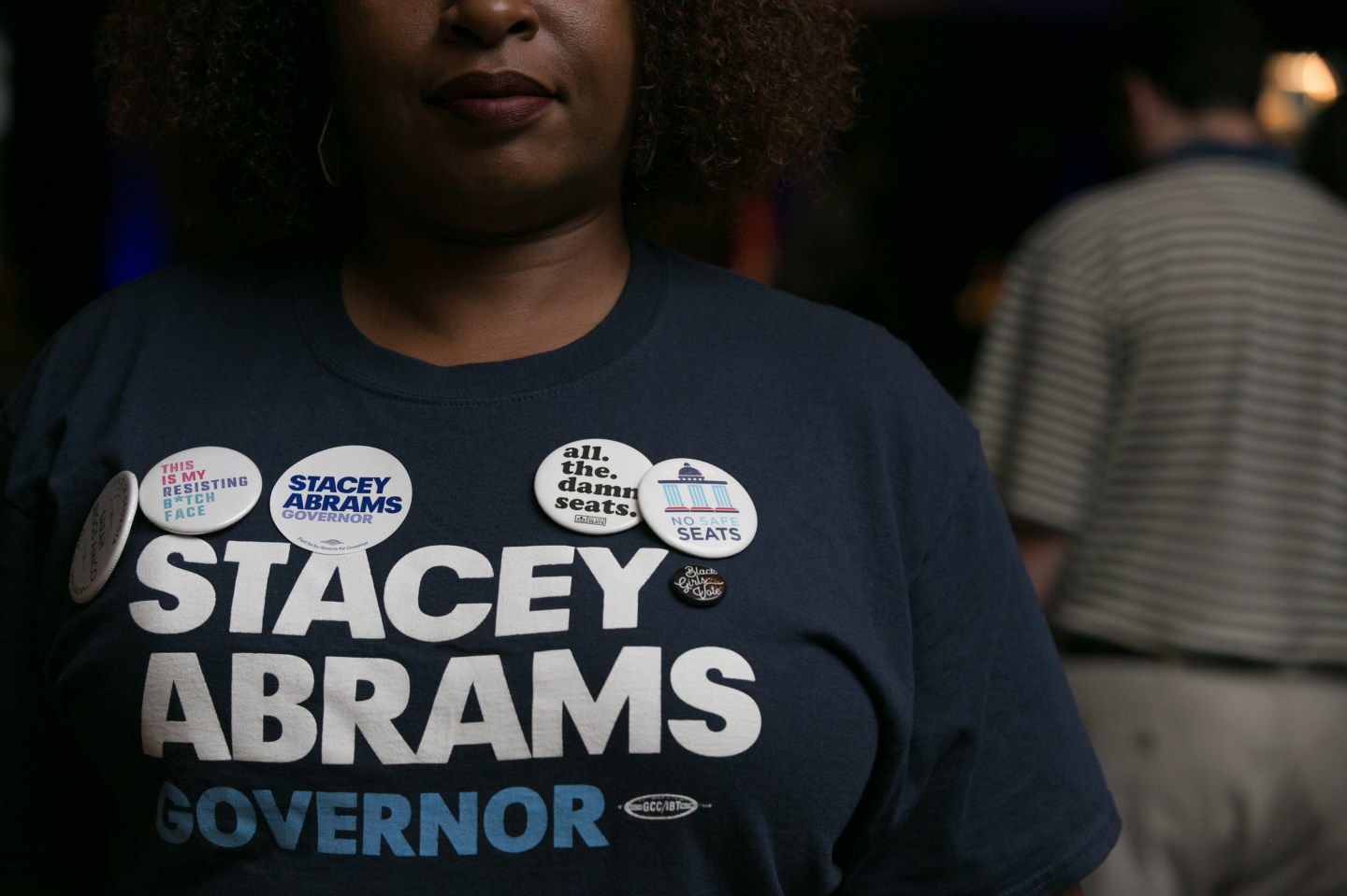 Supporter Nina Durham is adorned with political pins during the primary election night event for Georgia Democratic gubernatorial candidate Stacey Abrams on May 22, 2018 in Atlanta, Georgia.