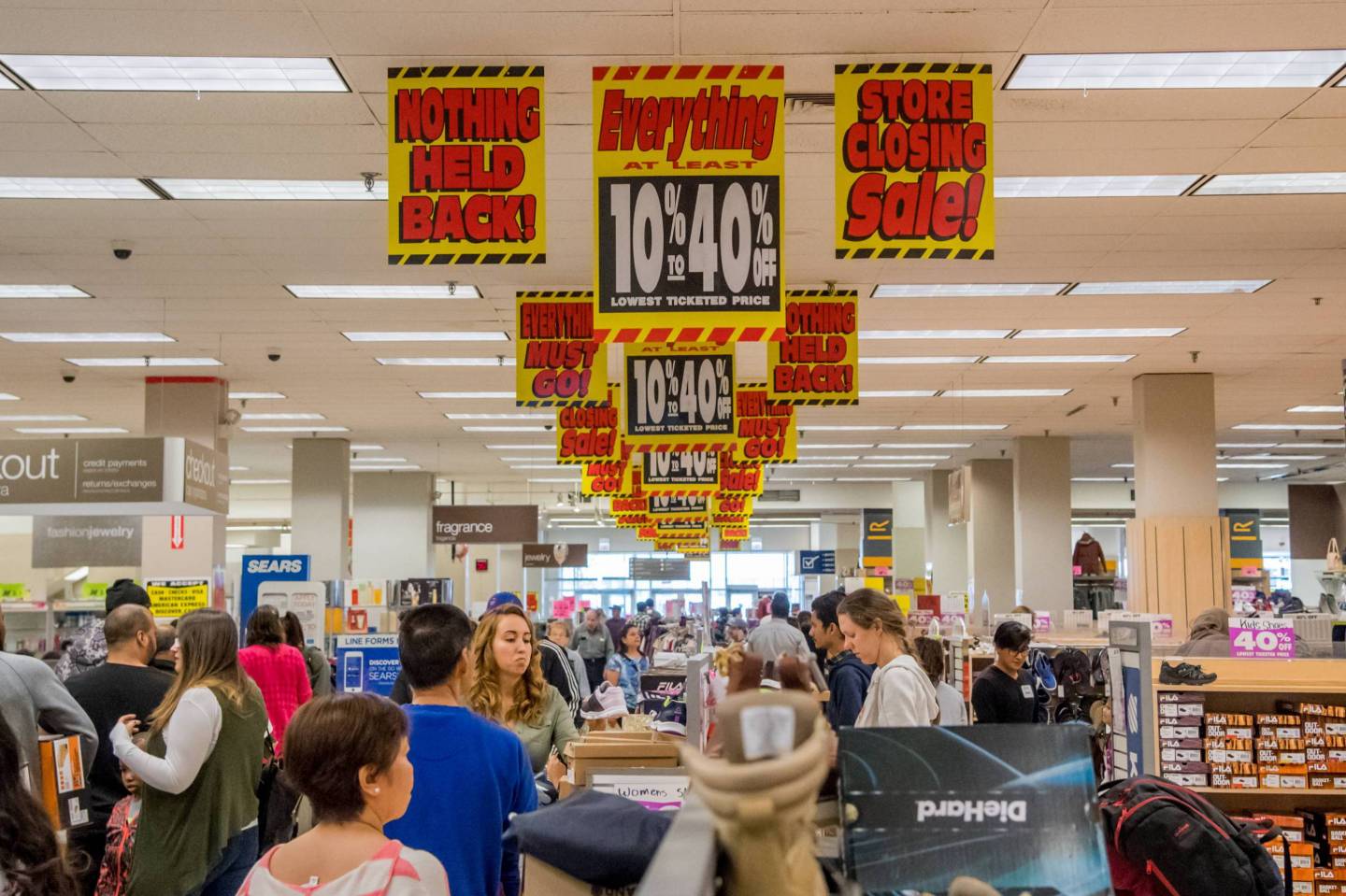 The last remaining Sears store in Chicago is covered in closing signs on May 13, 2018.