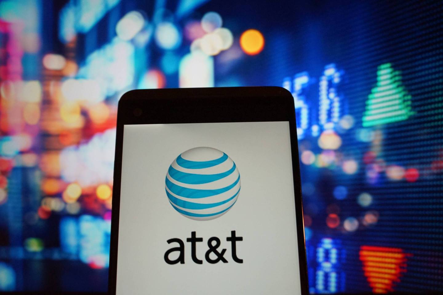 The logo of AT&amp;T is seen in a smartphone