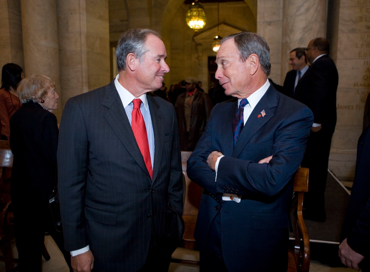New York City Mayor Michael Bloomberg and Blackstone CEO Stephen Schwarzman talk after a news conference at the New York Public Library.