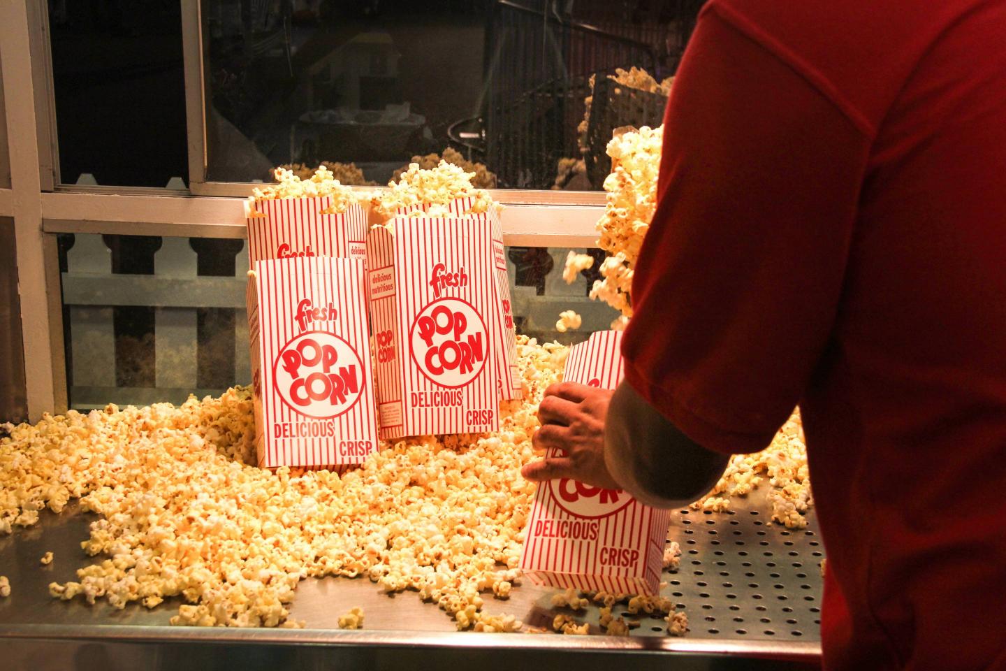Popcorn vendor inside a concession stand