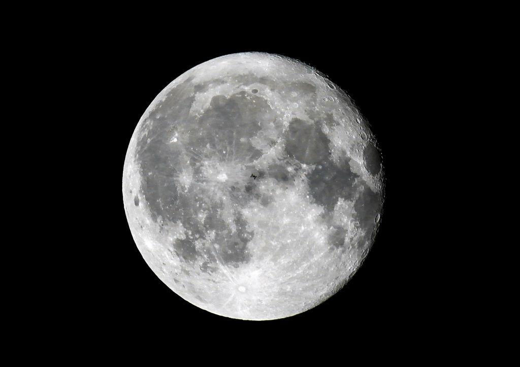 International Space Station transit across moon disc