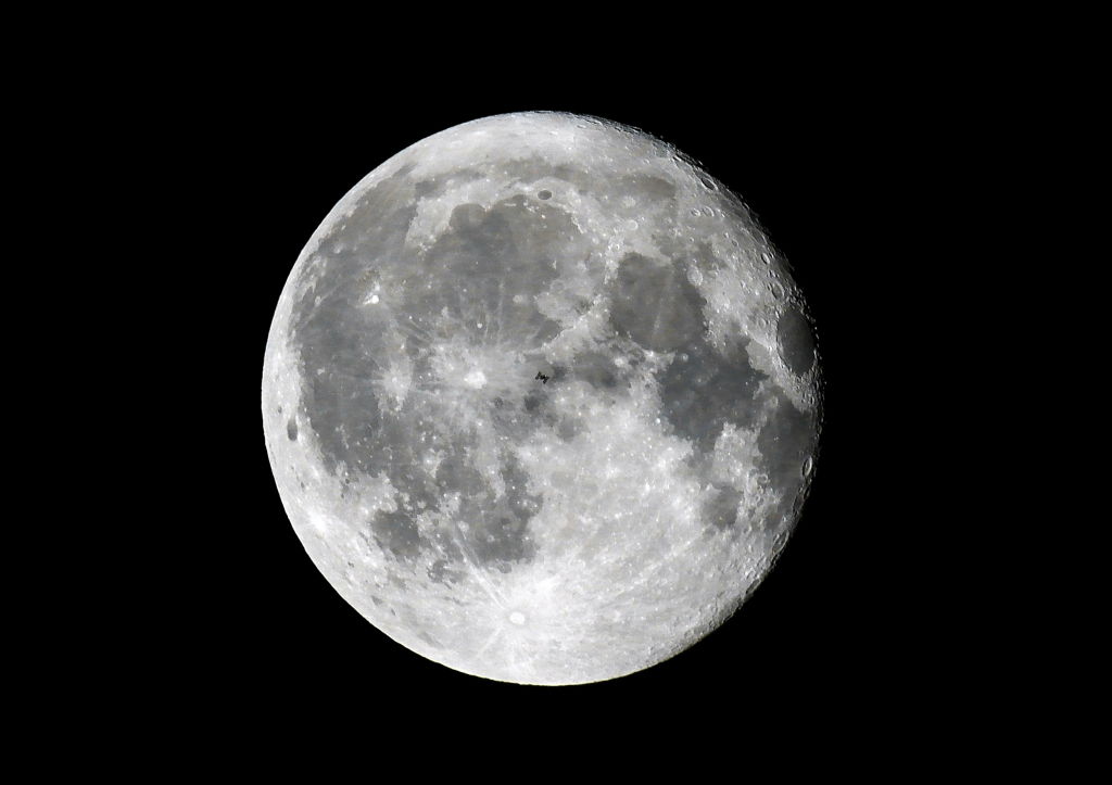 International Space Station transit across moon disc