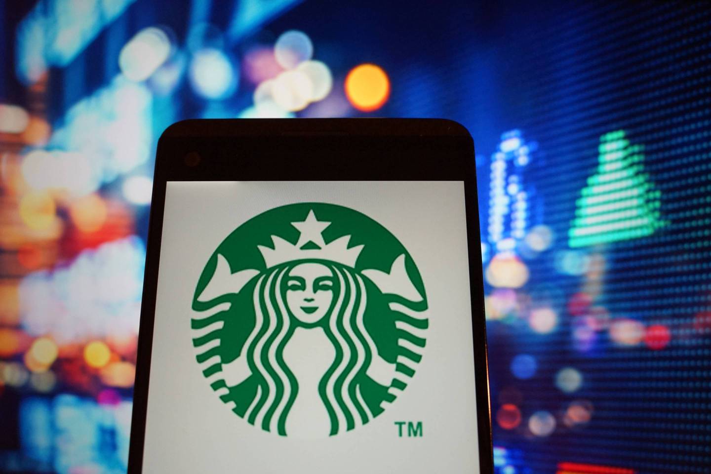 The logo of Starbucks is seen in a smartphone