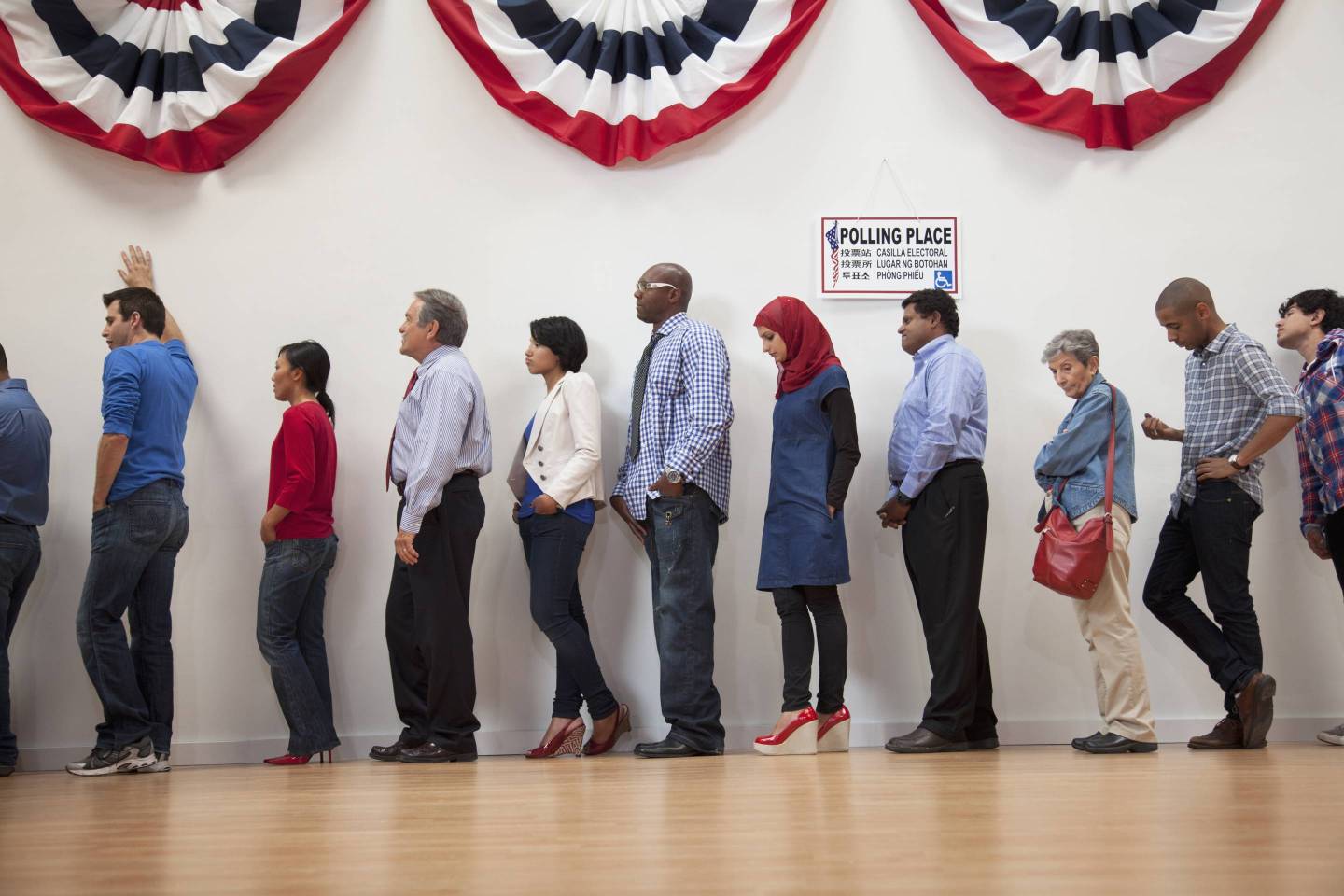 Voters waiting to vote in polling place