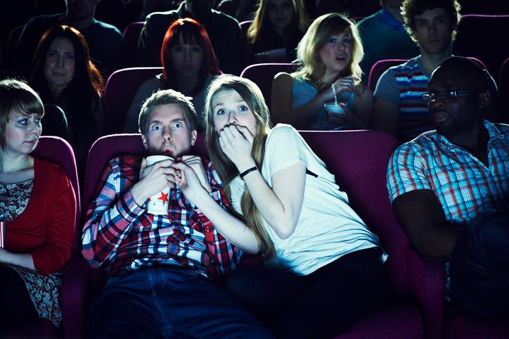couple enjoying a movie at the cinema