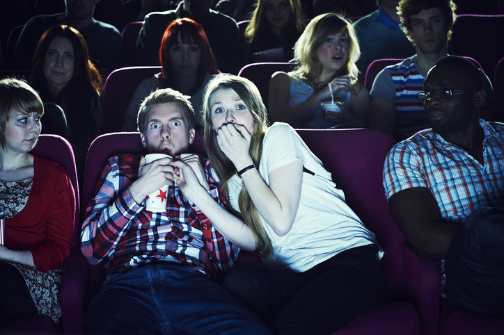 couple enjoying a movie at the cinema