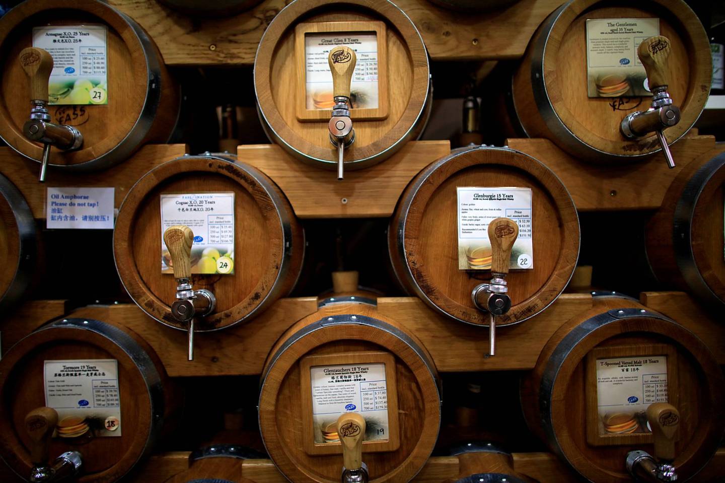 Vats of whisky are seen in a specialty shop in Singapore