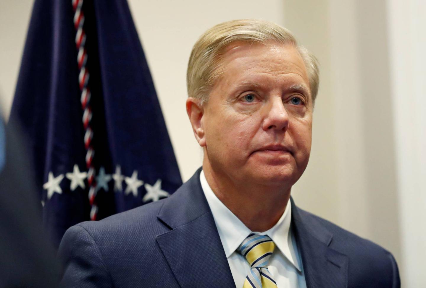 Sen. Lindsey Graham (R-SC) waits for U.S. President Donald Trump to enter the room to speak about the "First Step Act" in the Roosevelt Room at the White House in Washington, U.S.
