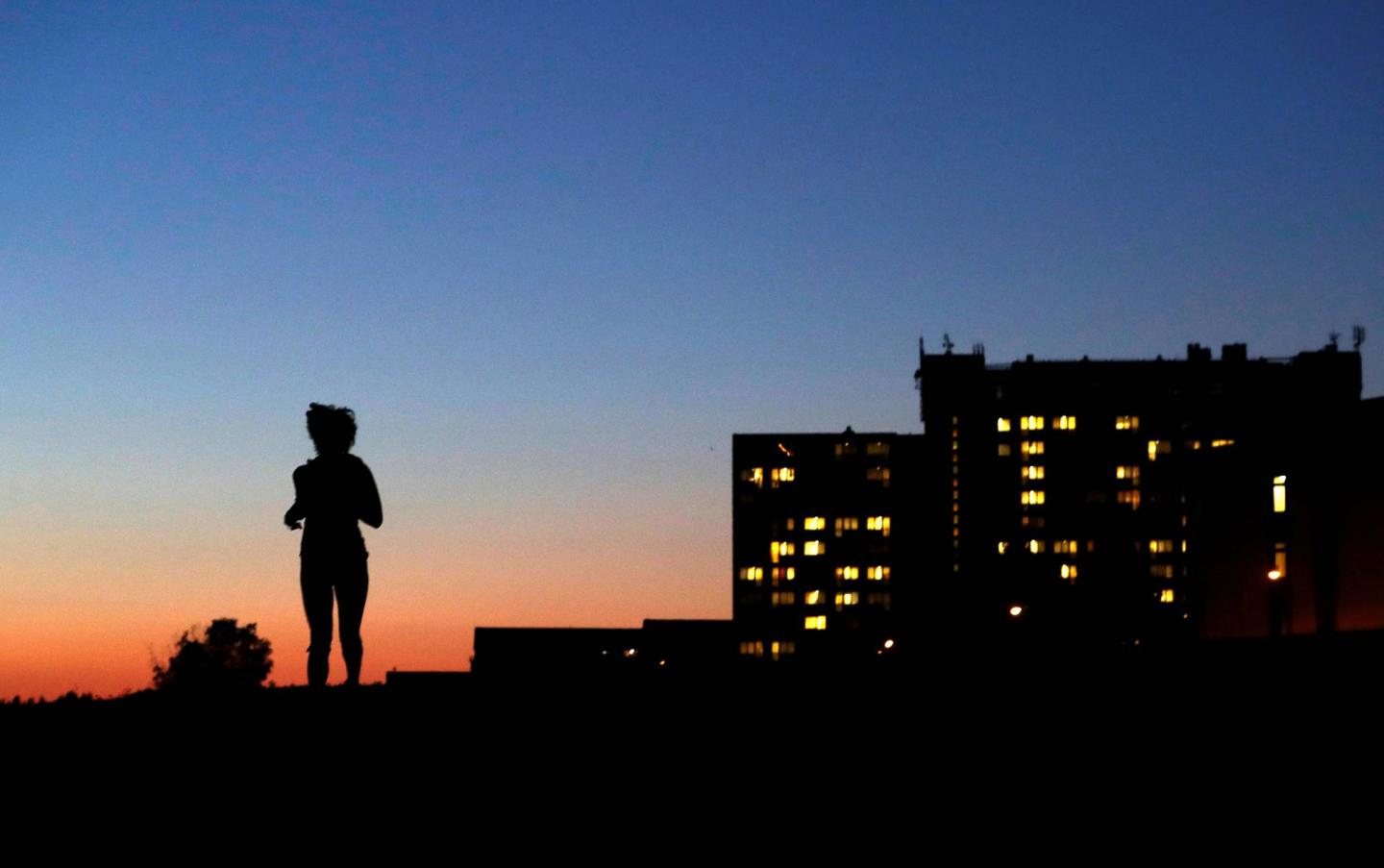 Student jogs past a dormitory in Prague