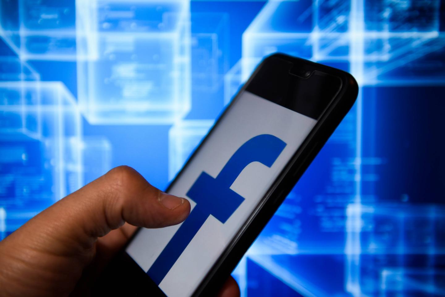 Facebook logo is seen on an android mobile phone