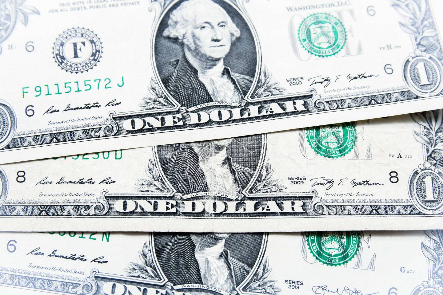 One (1) dollar bills seen displayed