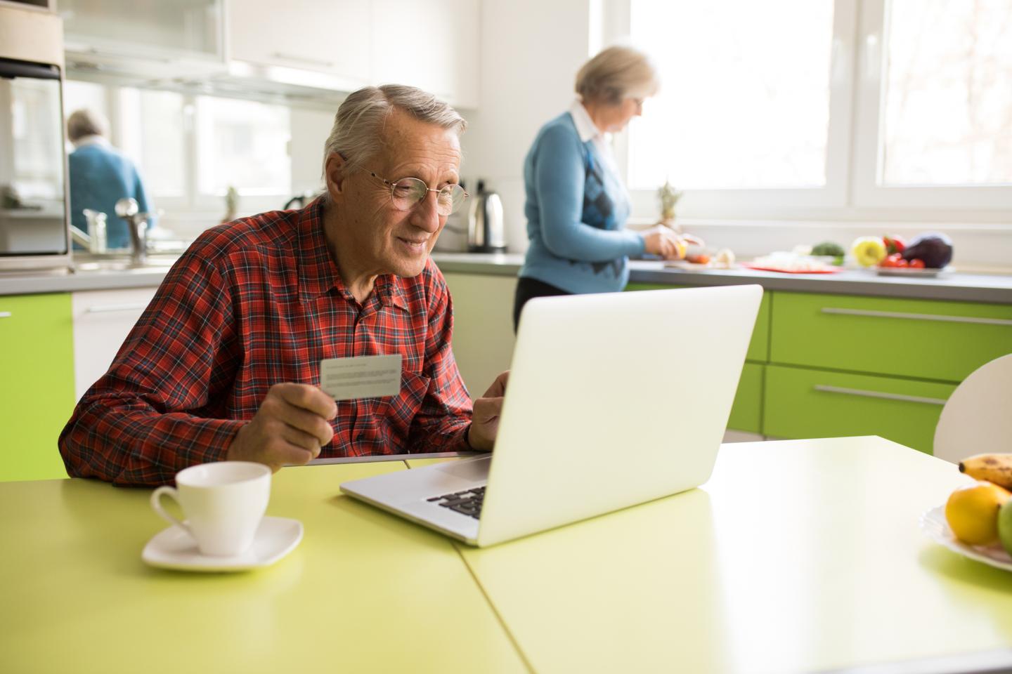 Senior man shopping online