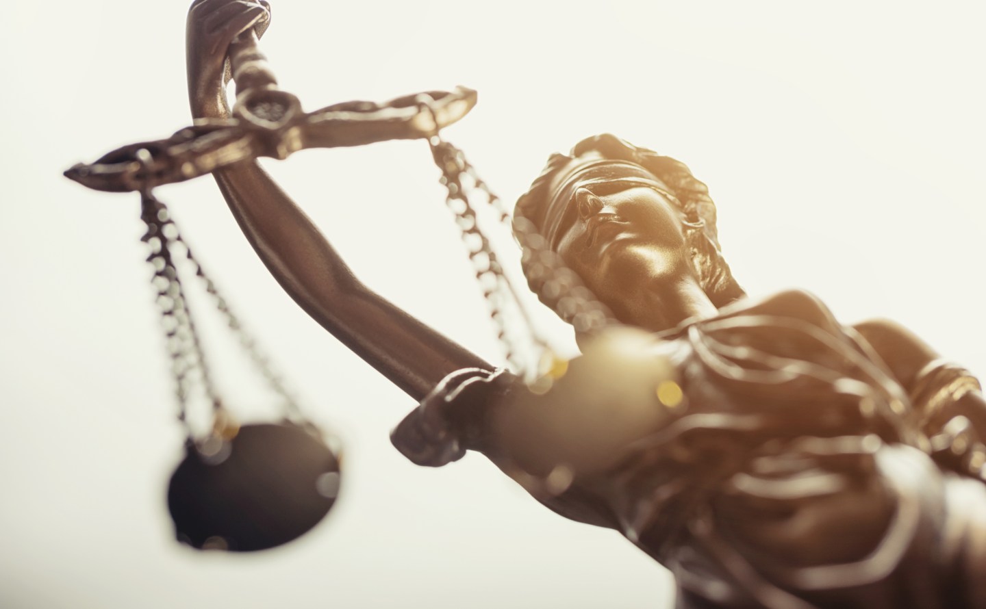 Statue Of Lady Justice Against White Background