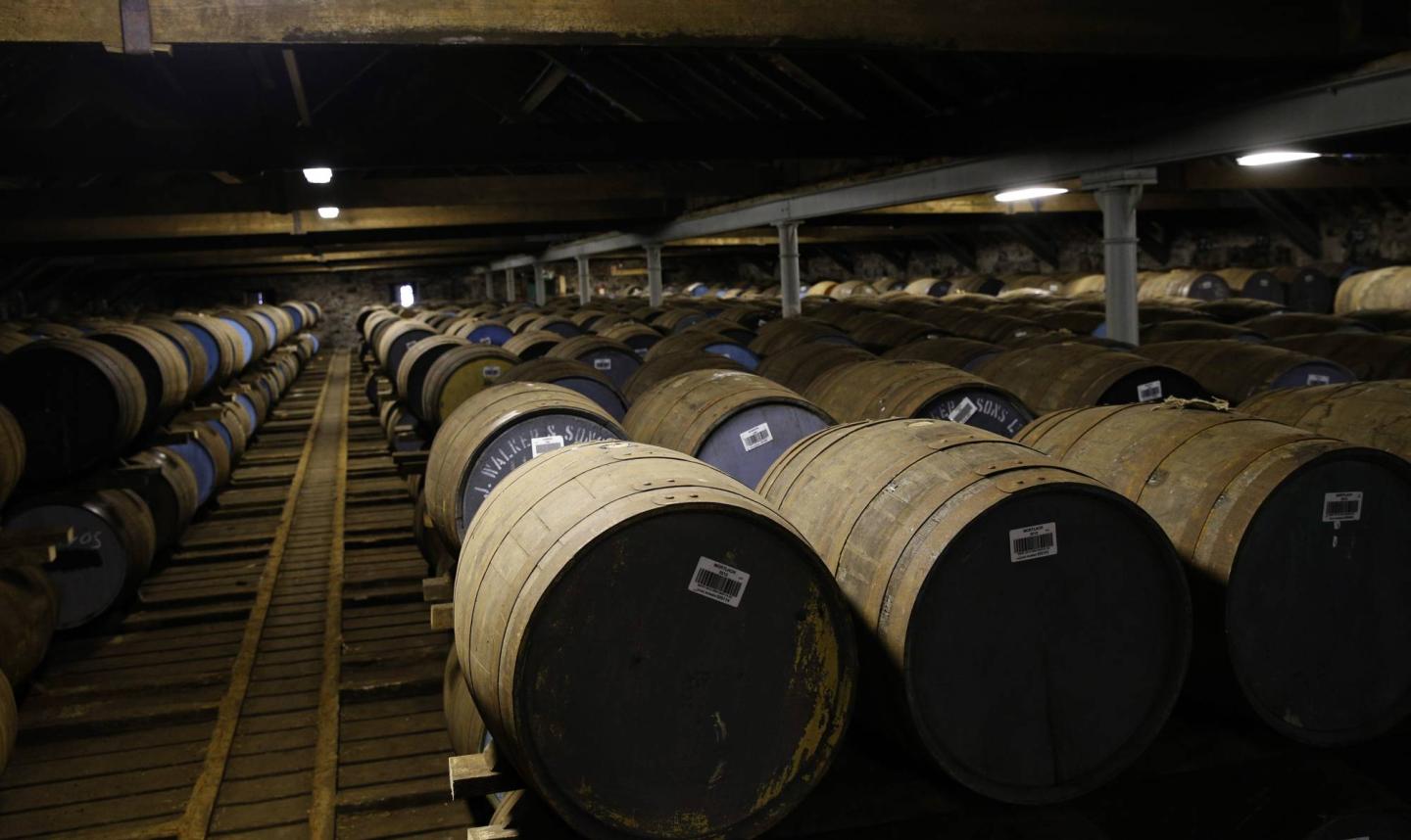 Whisky barrels are seen in the warehouse of the Diageo Cardhu distillery in Scotland