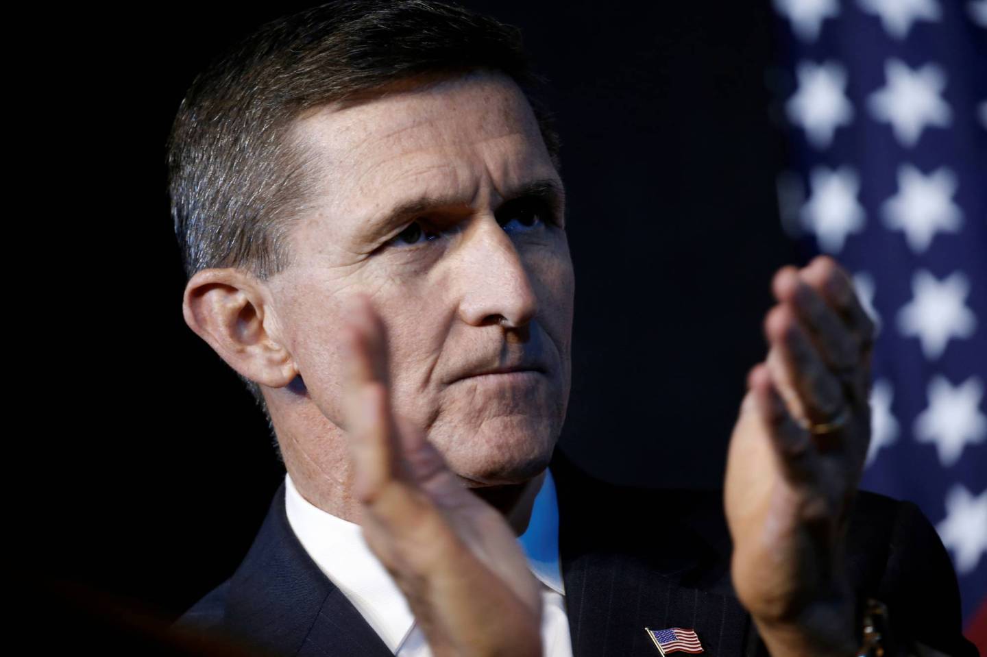 Retired U.S. Army Lieutenant General Michael Flynn reacts at a campaign event for then Republican presidential nominee Donald Trump in Herndon