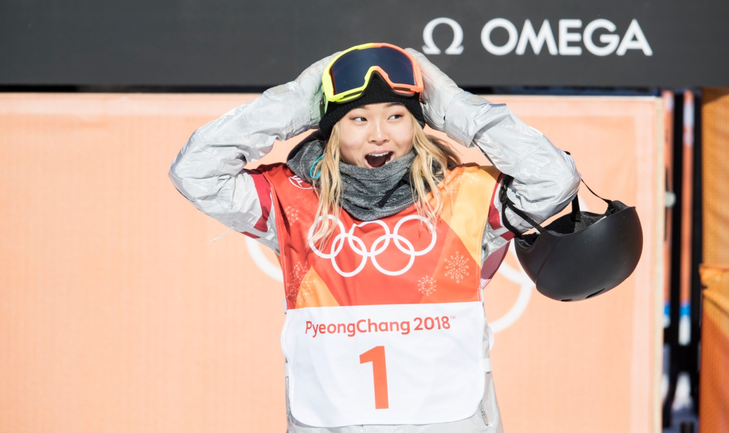 Chloe Kim reacts to her first run score during the women's snowboarding halfpipe final on at the PyeongChang 2018 Winter Olympic Games on Feb. 13, 2018.