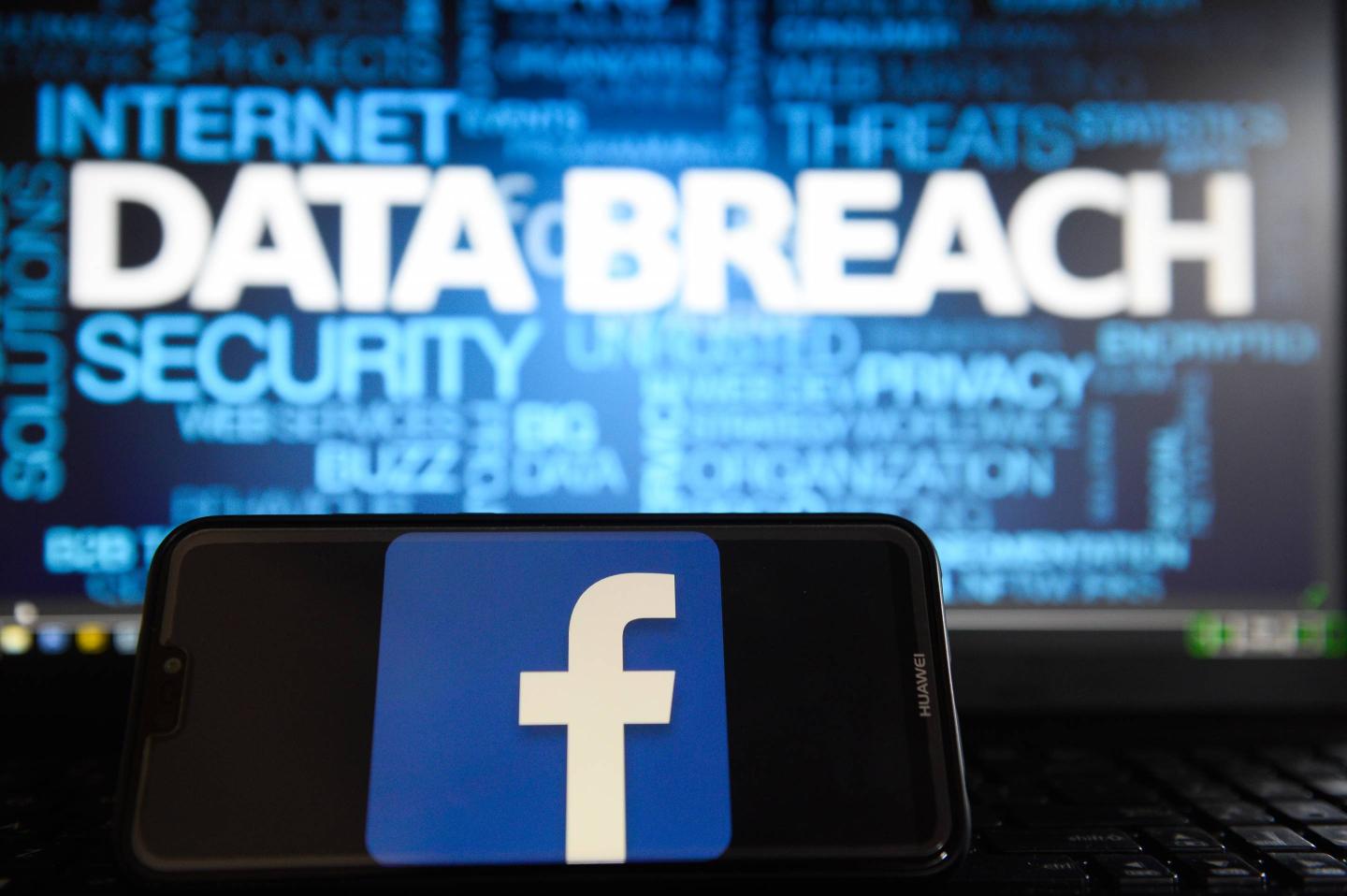 The Facebook logo is seen on a smartphone.