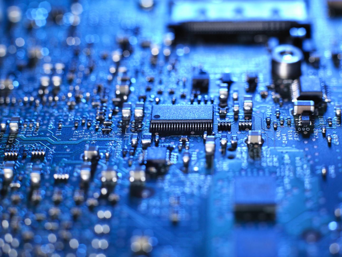 Inside of a laptop computer showing chips, circuit boards and components