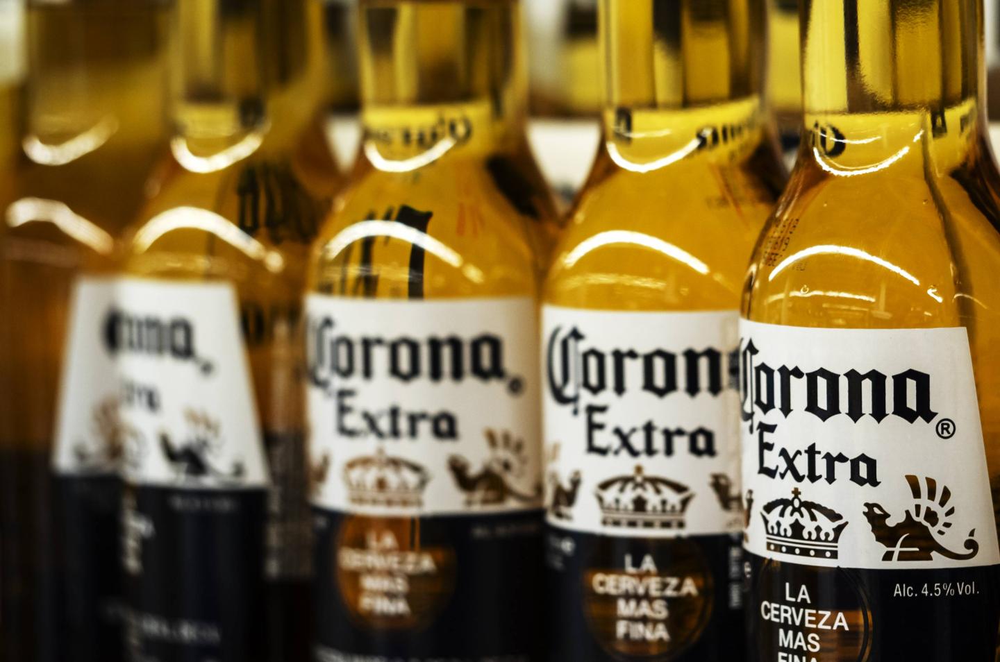 Detail of lined up Corona beer bottles seen on the store