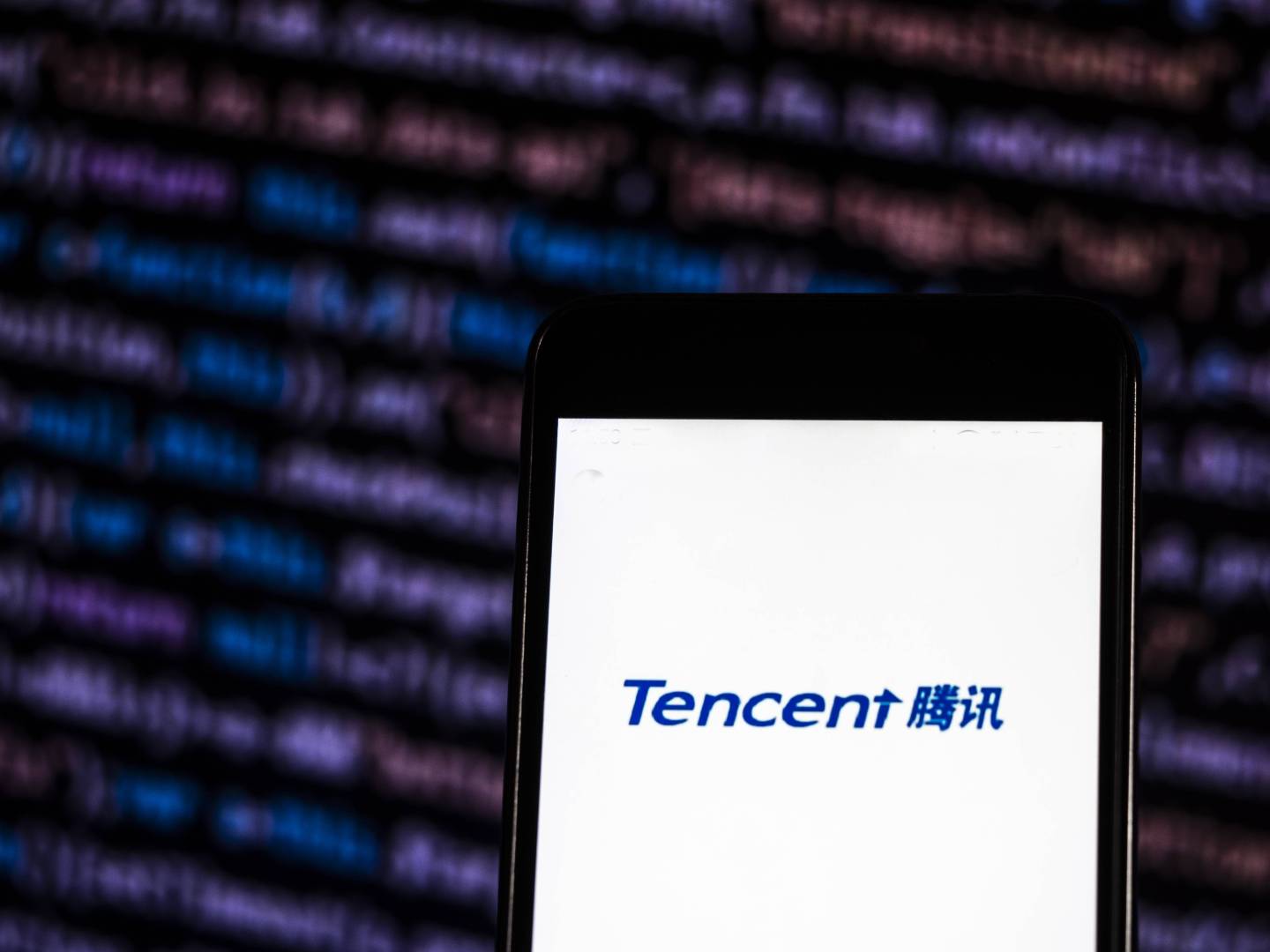 The Tencent logo seen displayed on a smart phone. According