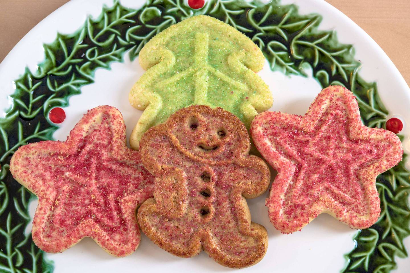 Gingerbread surrounded by other colorful cookies. High angle