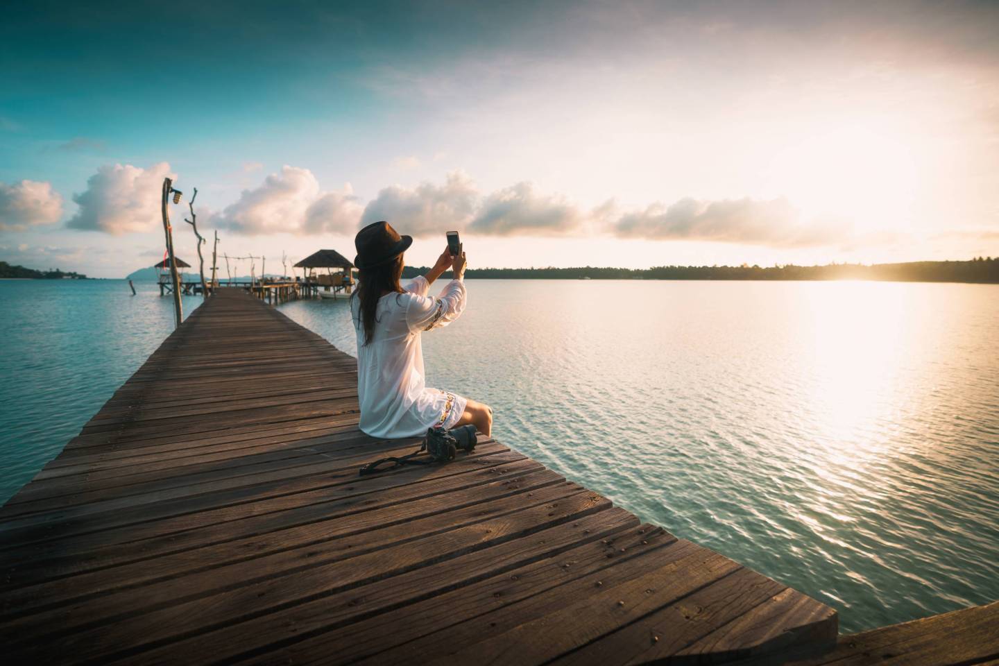 Female tourist taking photograph with a smart phone
