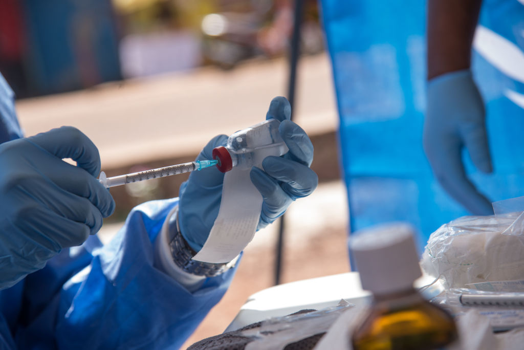 Doctors work with an Ebola vaccine in the Democratic Republic of Congo