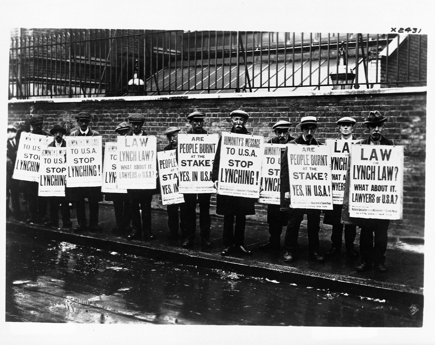 British NAACP Members Hold Anti-Lynching Signs