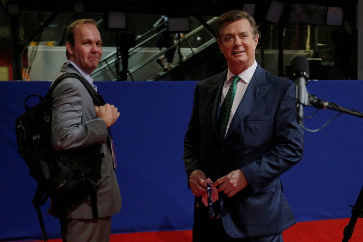 Paul Manafort and Rick Gates stand on the floor of the Republican National Convention in Cleveland