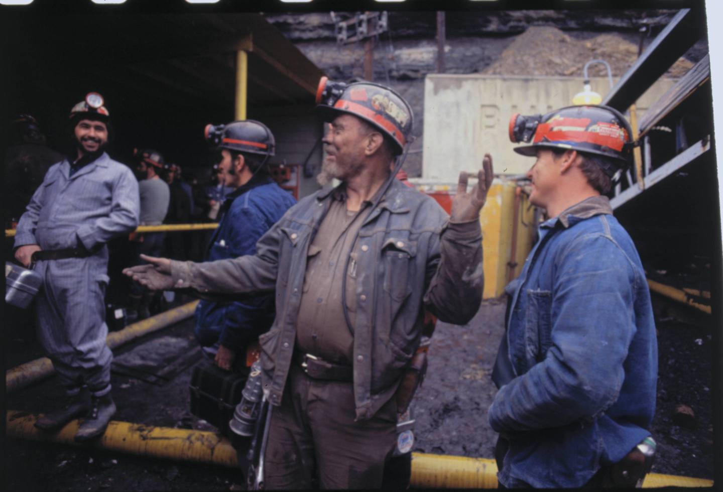 Miners Conversing Outside Shaft