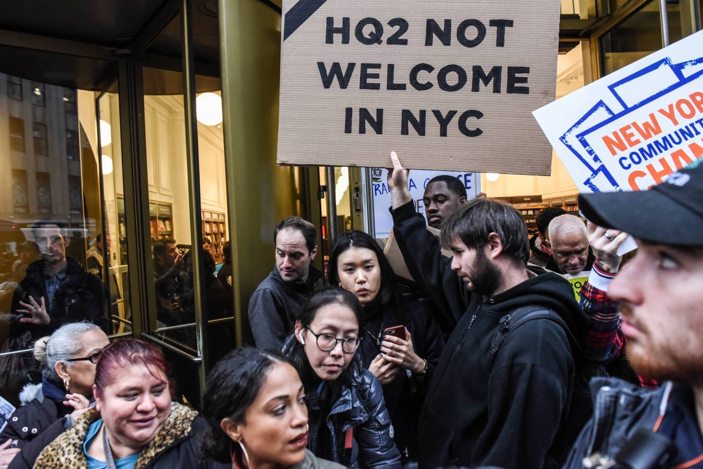 People opposed to Amazon's plan to locate a headquarters in New York City hold a protest inside of an Amazon book store on Nov. 26, 2018.