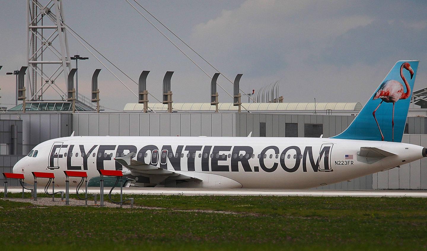 Sick passengers are being held for observations after throwing up on Frontier flight to Tampa from Cleveland.