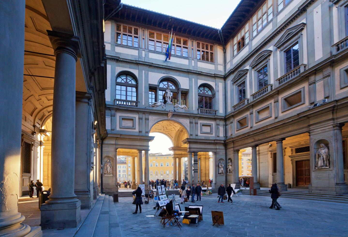 Galleria degli Uffizi museum. narrow courtyard between palace's two wings with view toward the Arno. Florence. Tuscany. Italy
