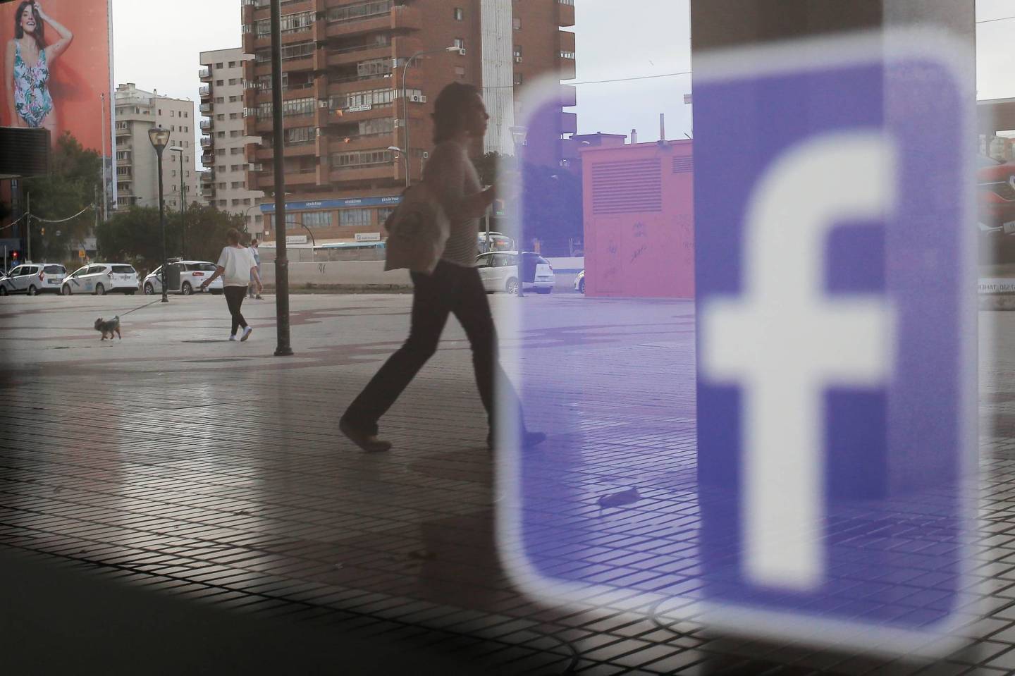 Facebook logo is seen on a shop window in Malaga