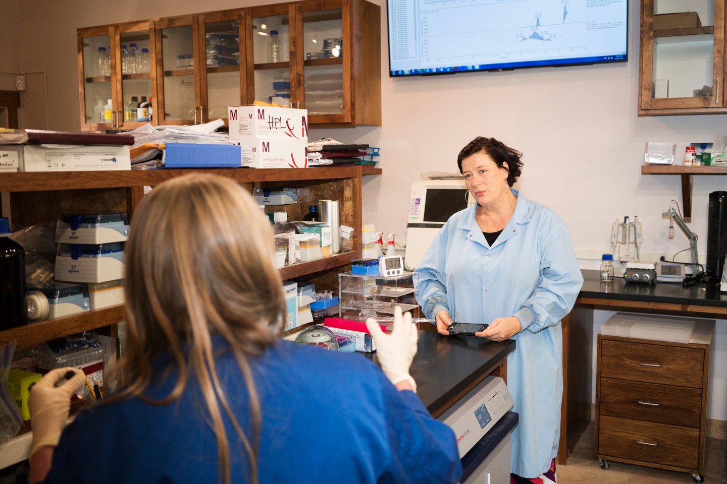 Rachel Dunlop, facing, talks with Sandra Banack at the Brain Chemistry Labs in Jackson Hole, Wyoming on October 24, 2018.