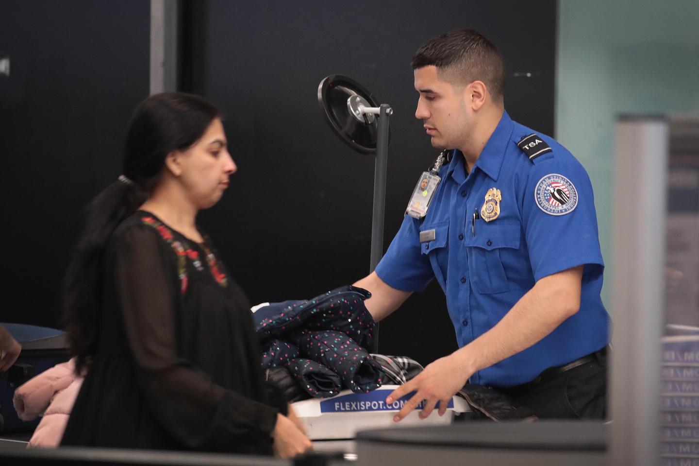 TSA Agents Work At Airport Security As Government Shutdown Continues