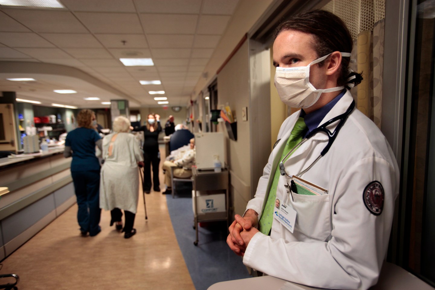 John Dwyer, a 3rd year medical student intern wears a mask to protect hiself from the flu virus. He