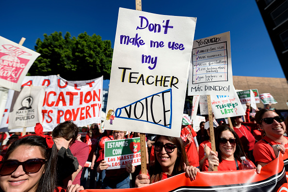 Teachers and supporters of public education march against education funding cuts during the March for Public Education in Los Angeles, California on December 15, 2018. The rally, organized by United Teachers Los Angeles, drew thousands of educators who demanded wage increases and smaller class sizes. (Photo by Ronen Tivony/NurPhoto via Getty Images)