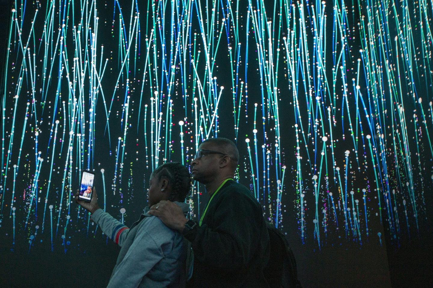 People watch an immersive video introduction to Qualcomm 5G tech