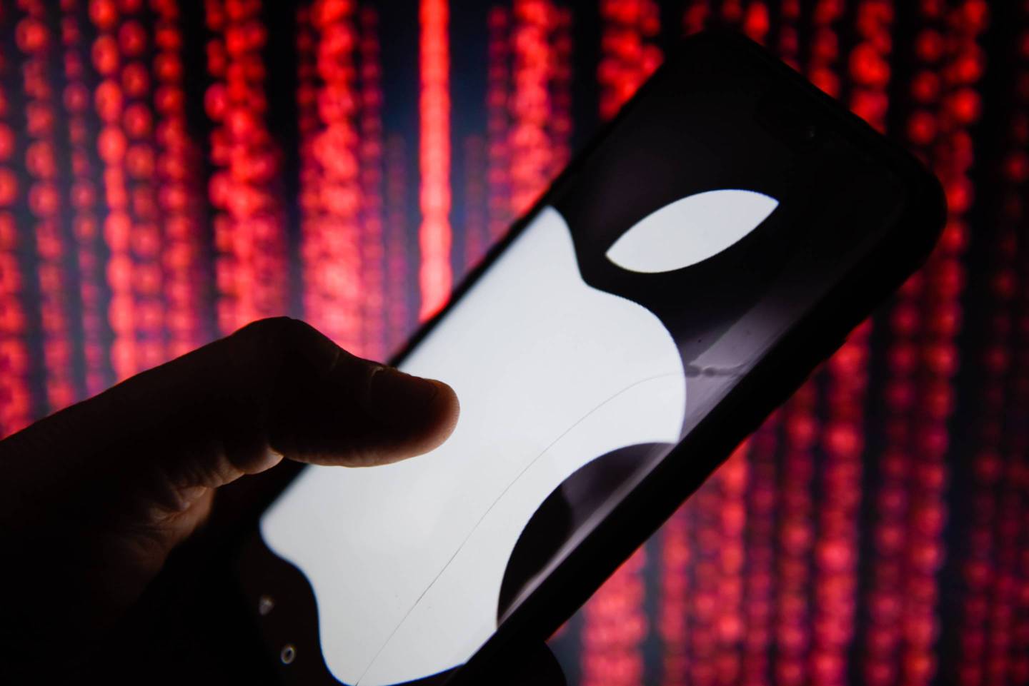 Apple logo is seen on a mobile phone