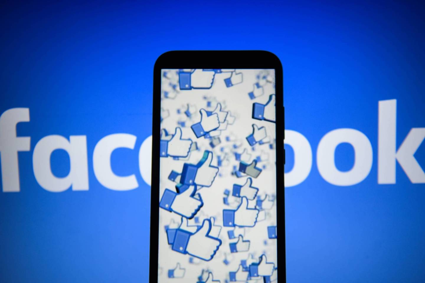 Facebook likes logo are seen on an android mobile phone