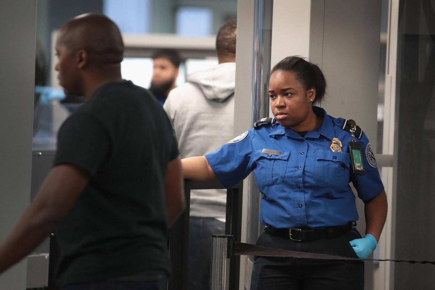 TSA Agents Work At Airport Security As Government Shutdown Continues