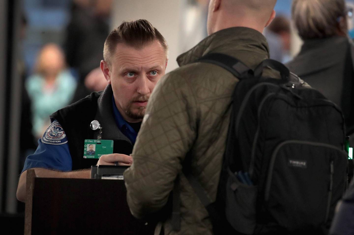 TSA Agents Work At Airport Security As Government Shutdown Continues