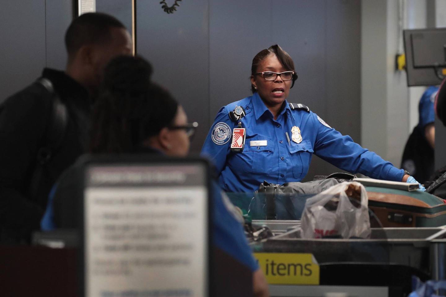 TSA Agents Work At Airport Security As Government Shutdown Continues