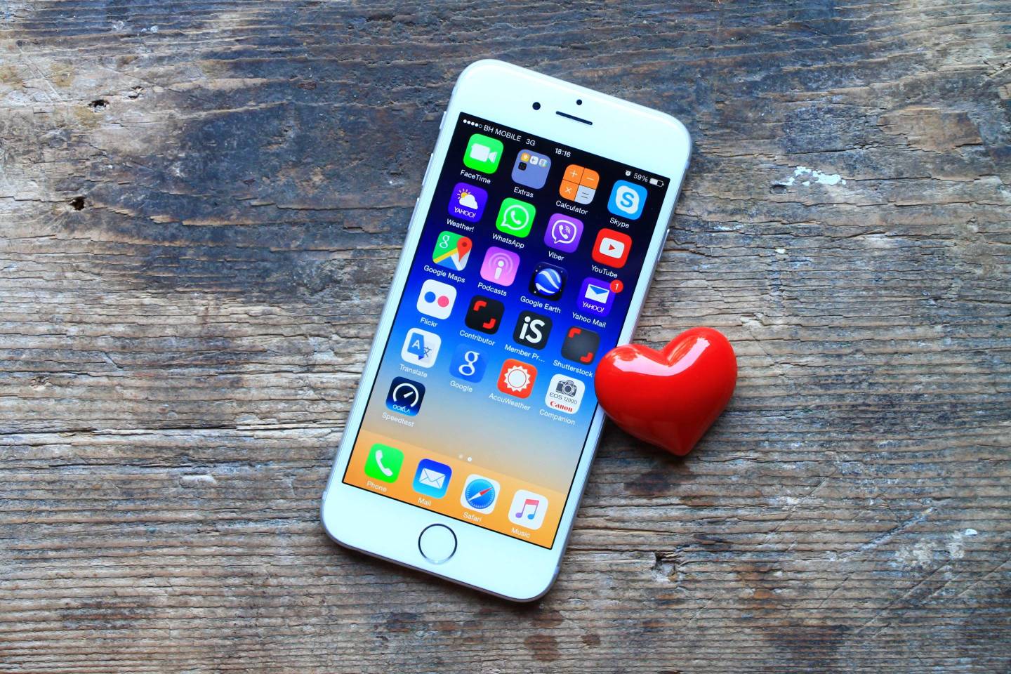 New gray iPhone 6 and small red heart