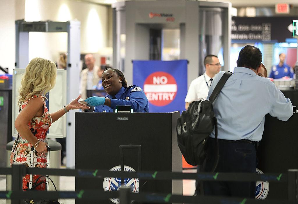 Transportation Security Administration Officials Demonstrates Time Saving Travel Tips At Miami Airport