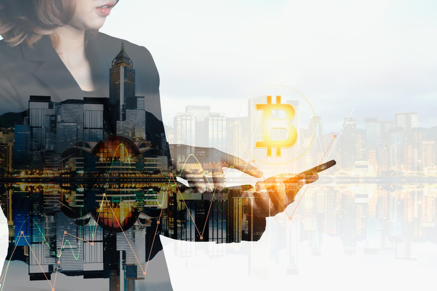 Businesswomen using the mobile phone deal bitcoin trading exchange stock market investment, forex with trend of graph technology concept