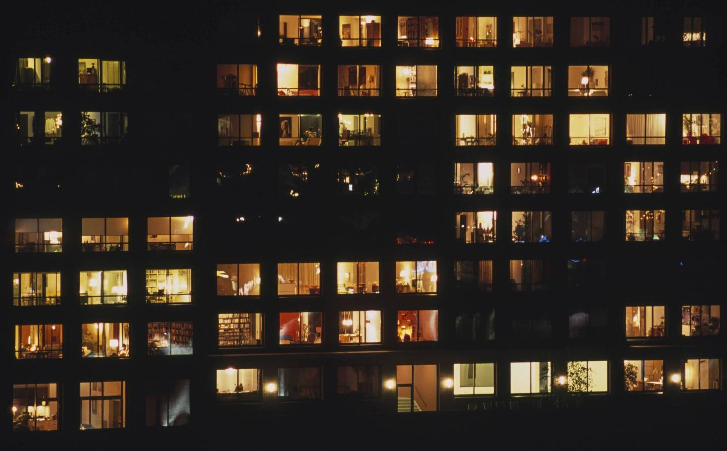 Building in Java-eiland neighborhood, at night, with illuminated windows, Amsterdam, Netherlands